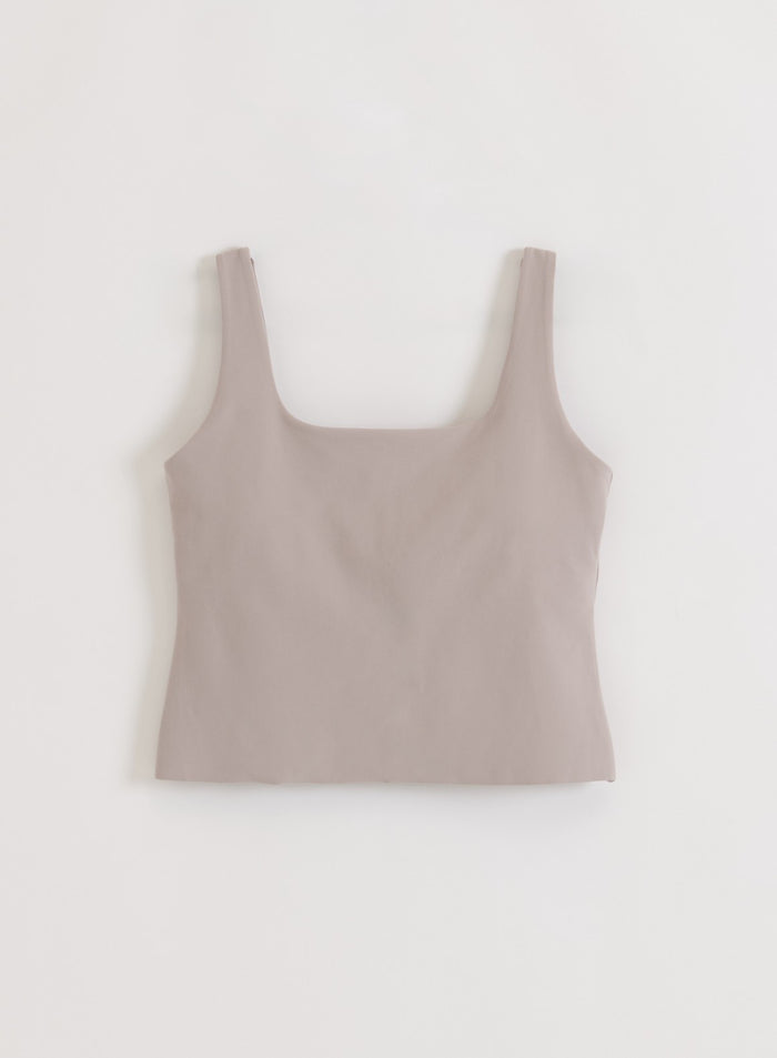 Dark clay -sävyinen aim'n Sense Singlet neliskulmaisella pääntiellä ja minimalistisella muotoilulla tasokuvassa.