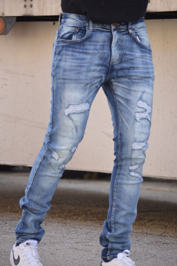 Dark washed blue DNM Story skinny denim jeans showcasing a fitted style and classic five-pocket design.