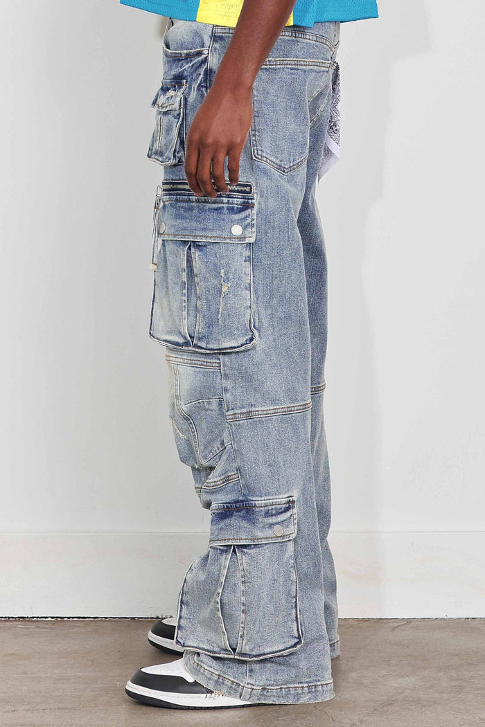 First Row Y2K multi cargo relaxed fit denim jeans in light stone tint, showing light wash denim with multiple cargo pockets.