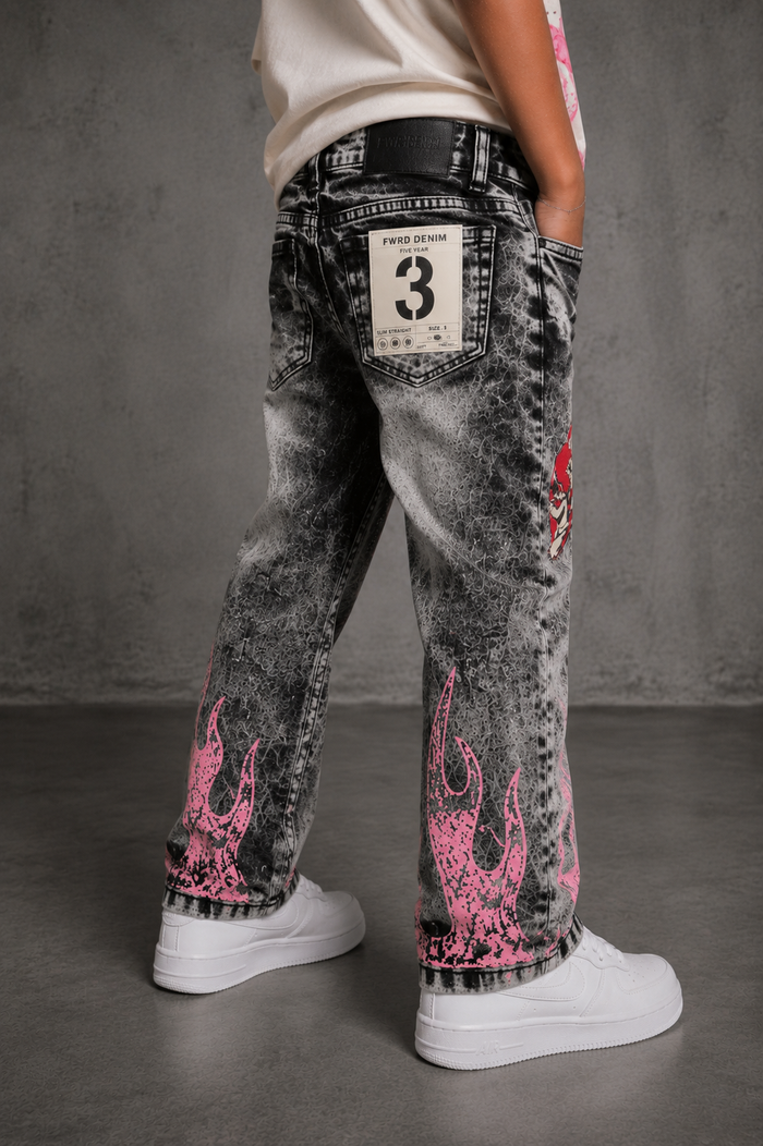 FWRD Kids Dreams slim straight washed black denim jeans for kids, shown hanging with a folded waistband and visible stitching.