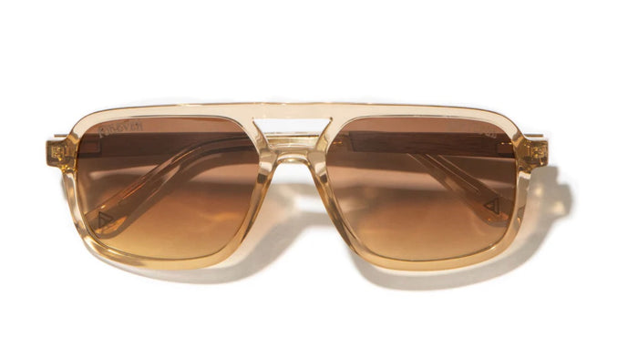 Camp Eyewear Grateful Dead Forever unisex sunglasses with a translucent champagne frame, walnut wood temples, and brown gradient polarized lenses.