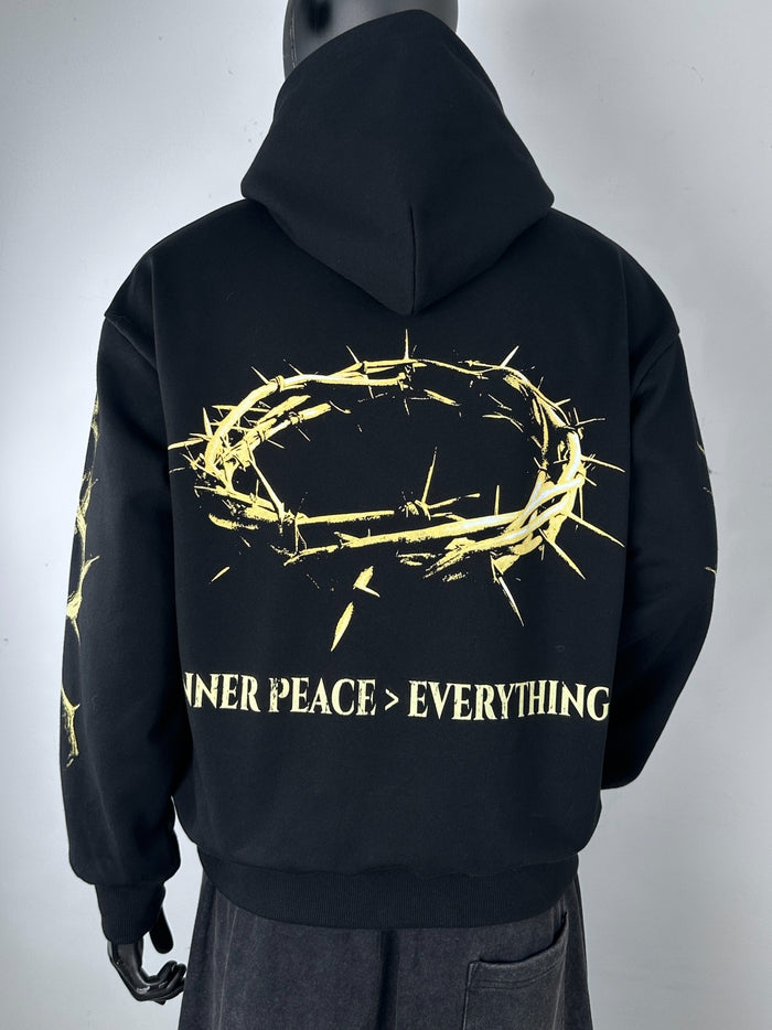 Inner Peace black hoodie with "IP Over Everything" slogan, casual pullover hoodie featuring comfortable fabric and relaxed fit.