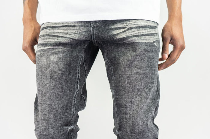 Stacked flare denim jeans in grey sand by Roar Denim, showcasing the stylish stacked design and casual fit.