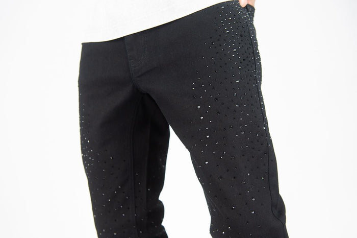 Black stacked flare denim jeans by Roar Denim with rhinestone embellishments and a high-rise fit.