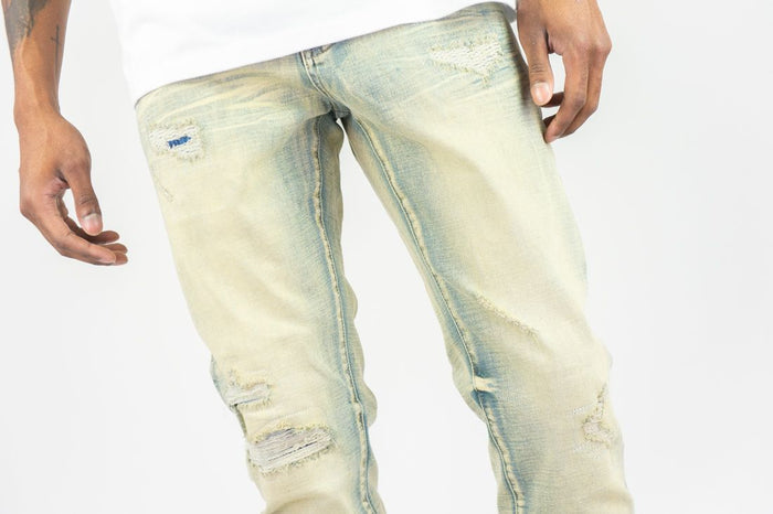 Roar Denim R&R slim straight vintage denim jeans displayed on a model, showcasing classic fit and faded blue wash.
