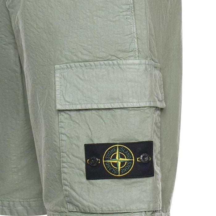 Stone Island green cargo shorts with multiple pockets and "OLD" effect garment-dye treatment.