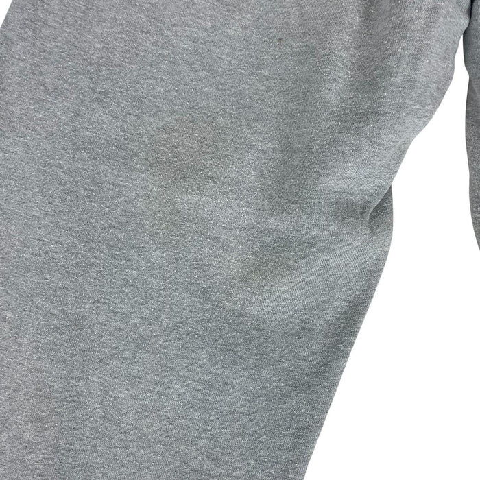 Stone Island grey tracksuit bottoms cotton material with logo patch and faint marks.