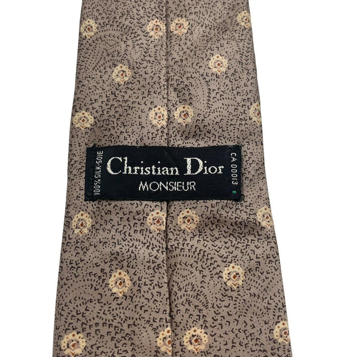 Christian Dior brown silk tie with subtle sheen and classic design elements.