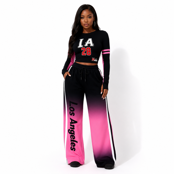 Black-to-pink gradient women's two piece set in a front view, showing the cropped top, wide-leg pants, and coordinated design