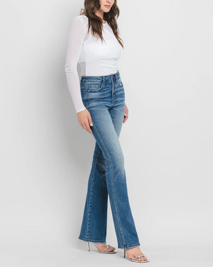 side view of high rise bootcut jeans in medium wash from Ardor Boutique