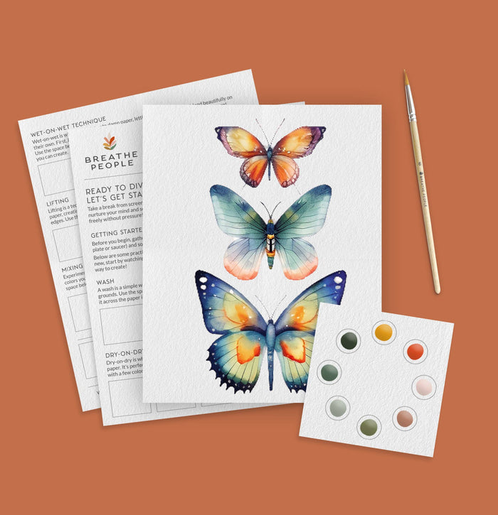 Butterfly illustration sheet with paint swatches and a brush on a brown background