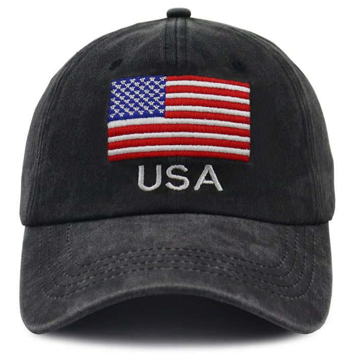 A washed black baseball cap featuring an embroidered American flag patch on the front with the letters 'USA' embroidered below in white.