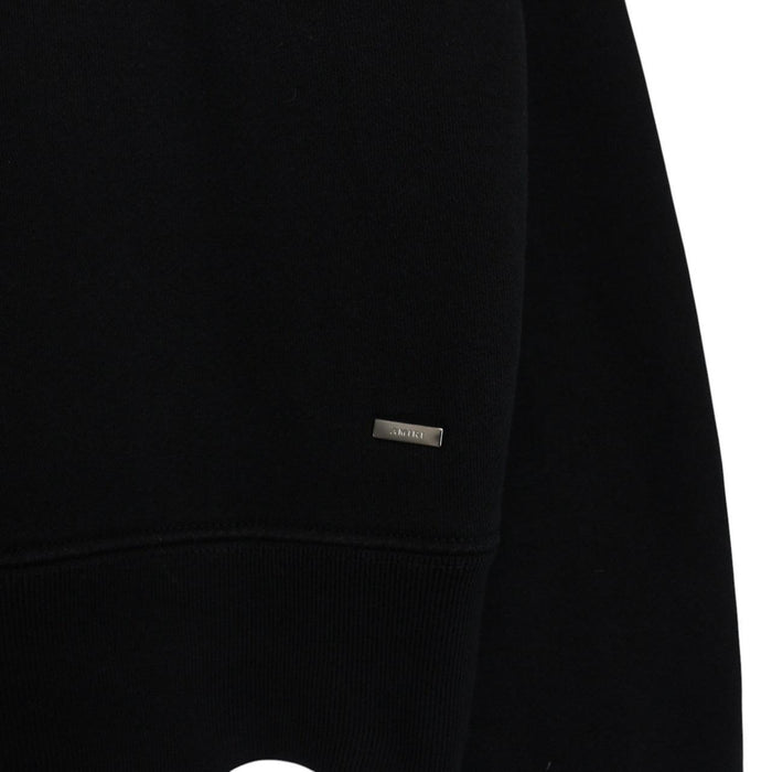 AMIRI black hoodie with rhinestone embellishments and crystal stick poke details.