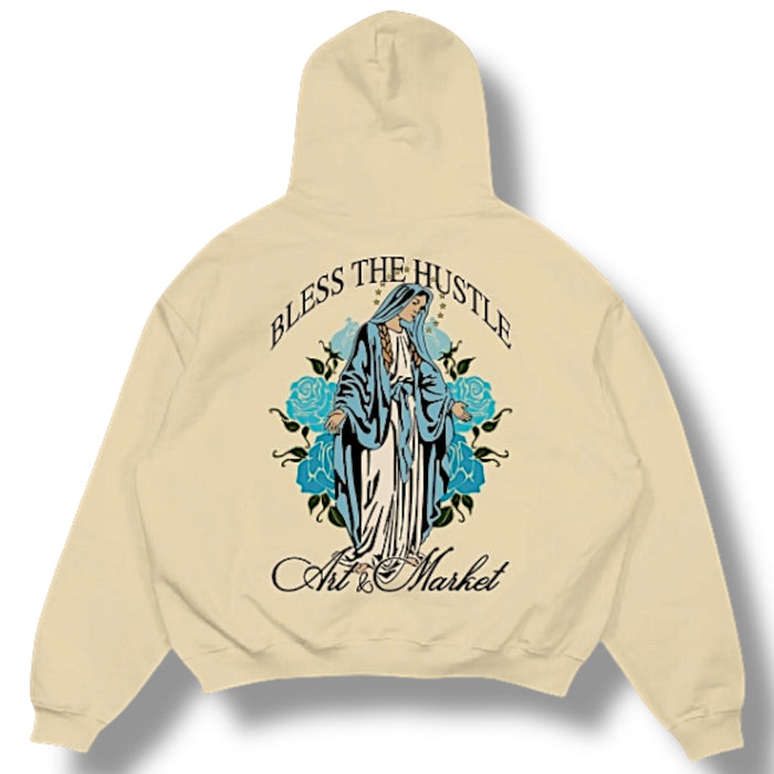 Beige Art & Market "Bless The Hustle" hoodie with front graphic, casual fit, soft fabric, and hooded design.