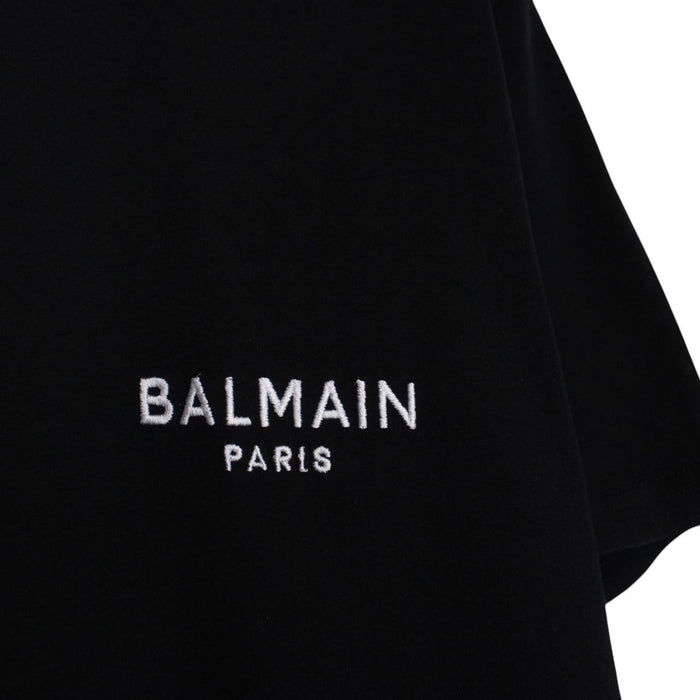 Balmain black pocket t-shirt with white embroidered logo and short sleeves.