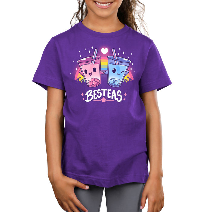 Premium Cotton T-shirt_TeeTurtle purple Besteas apparel featuring two bubble tea cups with happy faces, holding hands, surrounded by stars, with a rainbow in the background. Caption reads, "besteas".
