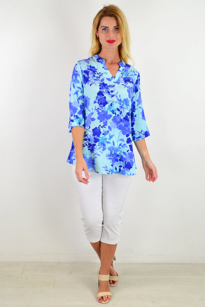 Blue floral tunic top from I Love Tunics featuring vibrant flower patterns and a relaxed fit.