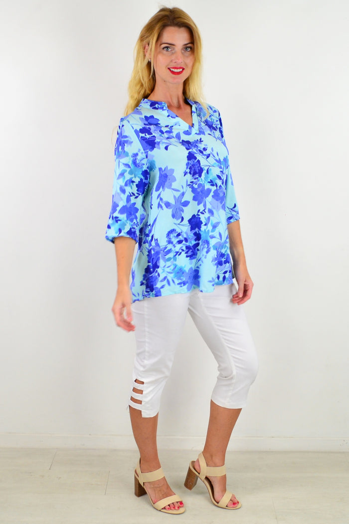 Blue floral tunic top from I Love Tunics with a vibrant pop of color and lightweight, flowy fabric designed for casual wear.