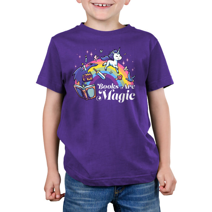 Premium Cotton T-shirt_TeeTurtle purple Books Are Magic(Unicorn) apparel featuring a rainbow, unicorn, dragon, and other mythical items coming out of a book. Caption reads, "books are magic".