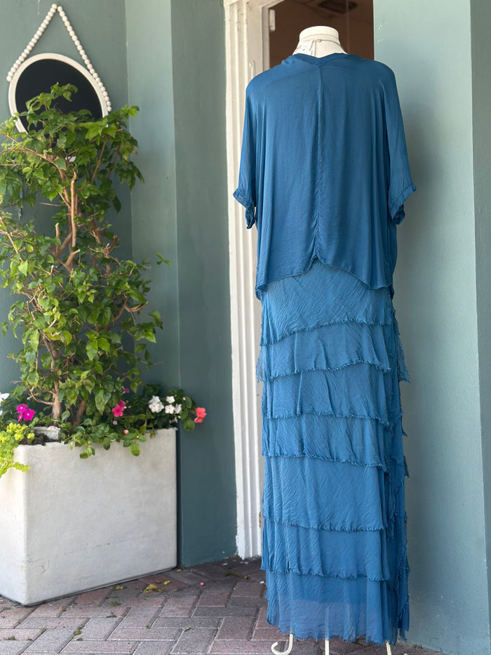 Back view of the Briella Silk Skirt in Prussian Blue showcasing the layered silk tiers, graceful drape, and soft stretch waistband.