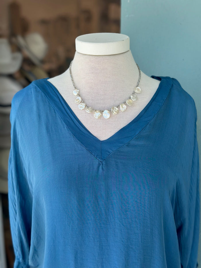 A strand of luminous freshwater baroque pearls brings natural texture and timeless sophistication to any look, making this necklace an easy favorite for both everyday wear and special occasions.