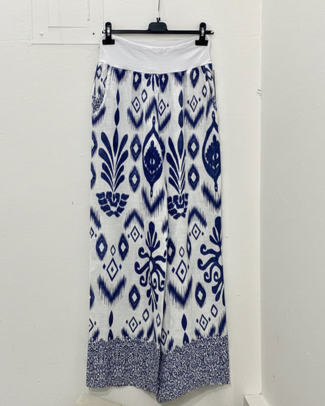 Brynn Italian linen wide-leg pants in navy and white geometric print with elastic pull-on waistband and border hem detail.