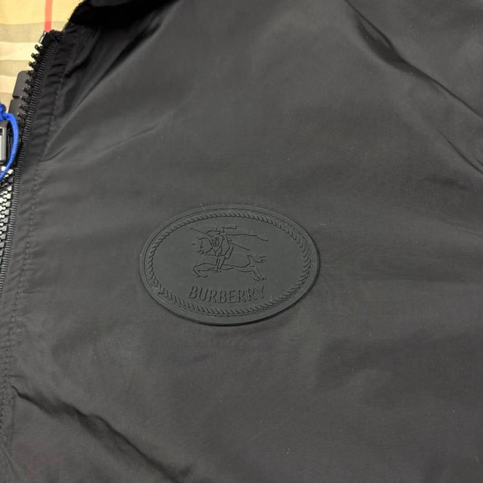 Burberry reversible windbreaker jacket in sand beige and black Nova Check pattern.