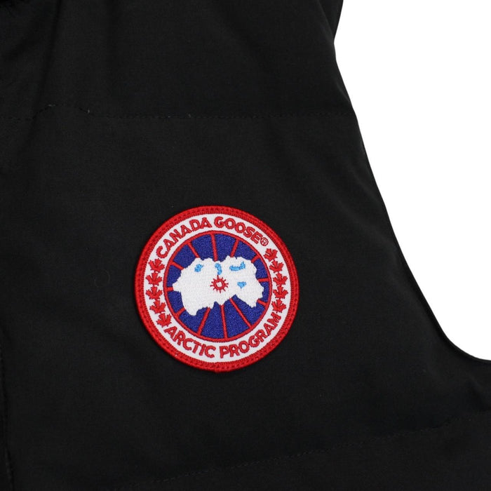 Canada Goose black down gilet with logo patch and zippered pockets.