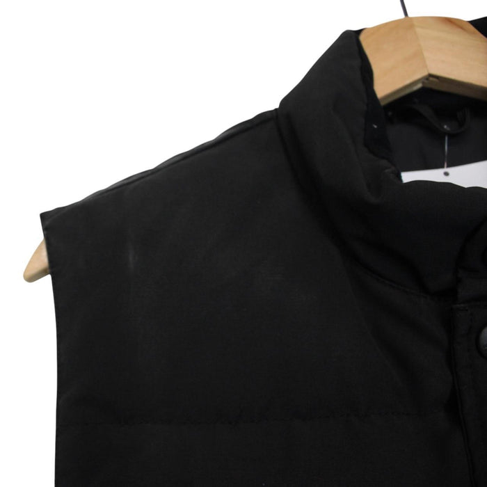 Canada Goose black down gilet with logo patch and original tags, very good condition.