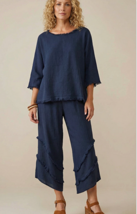 Cascadia Linen Pants in deep navy blue featuring a relaxed wide-leg silhouette, comfortable elastic waistband, and layered frayed seam detailing for an effortless coastal-inspired look.