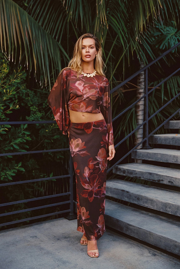 Floral mesh top with refined accents, a floral mesh dress essential.