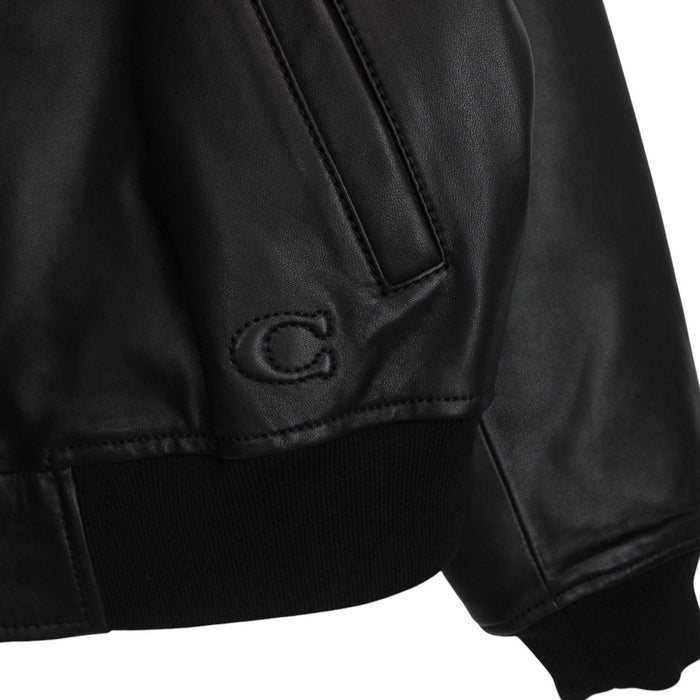 Coach black lamb leather bomber jacket with full zip and brand logo.