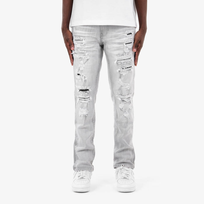 Copper Rivet Rip & Repair grey denim jeans with distressed details and copper rivet accents, showcasing the stylish denim product.