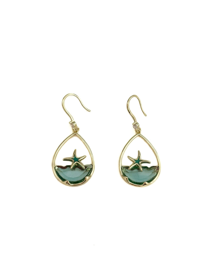 Teardrop-shaped earrings with starfish design on a white background