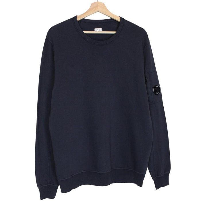 CP Company navy blue cotton sweatshirt with goggle lens detail and logo.