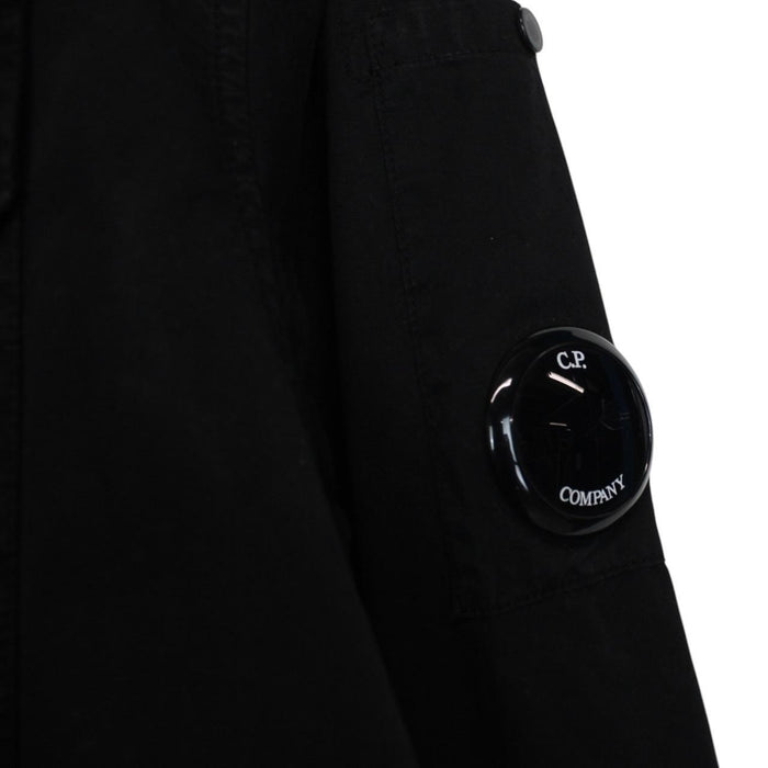 CP Company black button-up jacket with lens detail and cotton material.