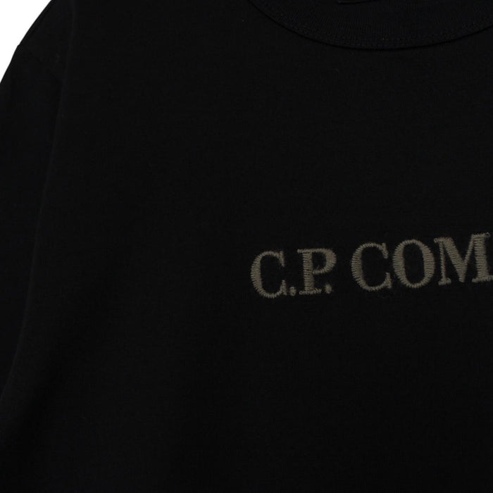 CP Company black pocket t-shirt with embroidered logo and mercerized cotton material.