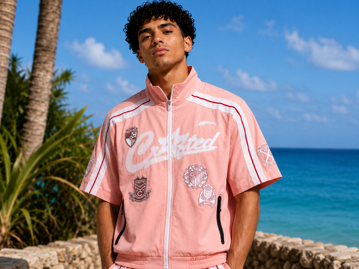 Pink Crafted nylon track suit zip-up jacket, lightweight and stylish athletic wear, with a full front zipper and fitted design.