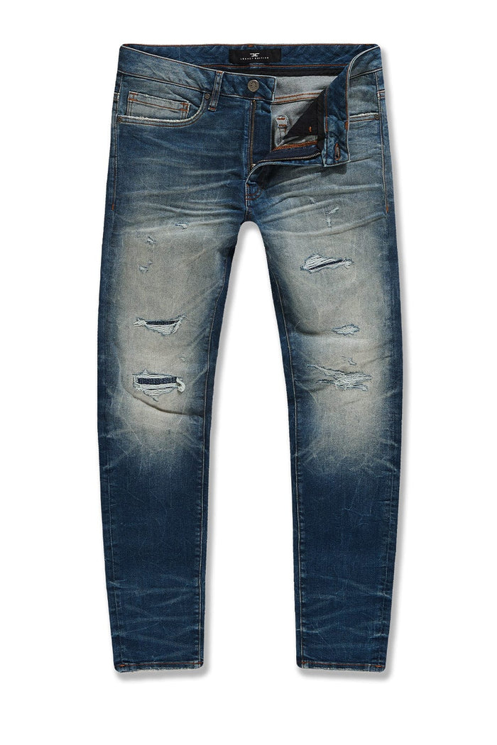 Jordan Craig Meadowlands desert blue denim jeans, shown in a natural stance, featuring classic denim texture and stitching.