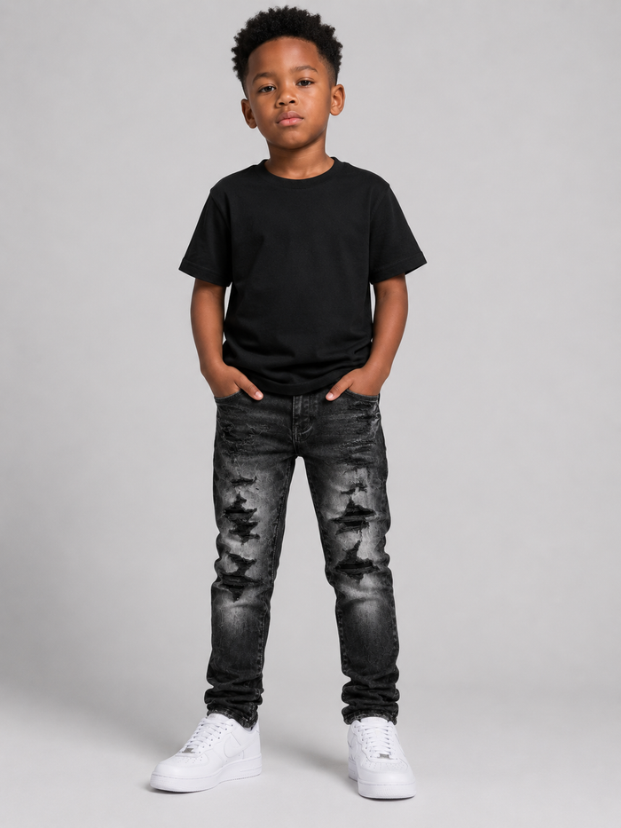 Jordan Craig Kids shredded black denim jeans with distressed detailing, featuring stylish shreds in a casual kids' denim fashion.