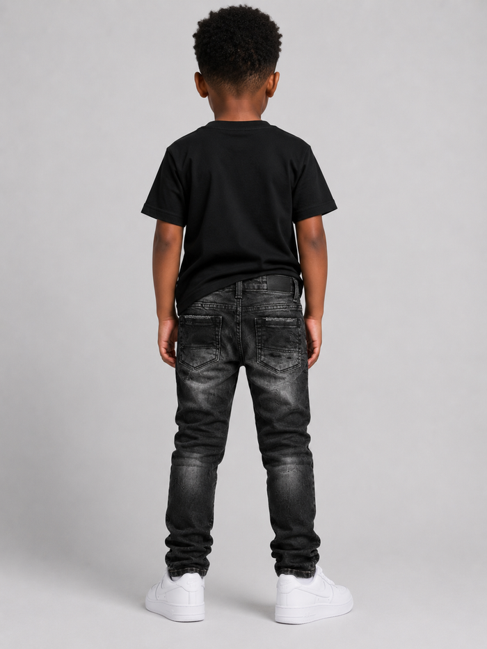 Jordan Craig Kids black shredded denim jeans with distressed details for a stylish, casual look.