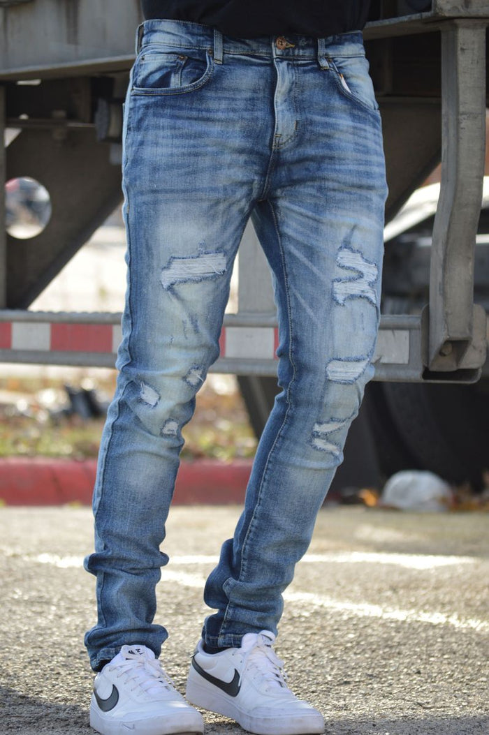 DNM Story Skinny Denim in Washed Blue, showcasing fitted denim jeans with a classic wash and detailed stitching.