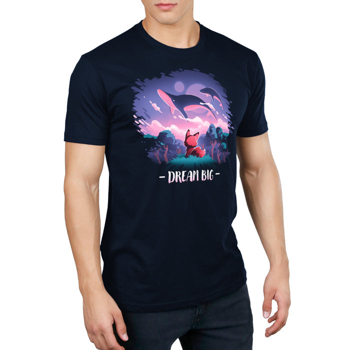 Premium Cotton T-shirt_TeeTurtle navy blue Dream Big featuring an orange fox who gazes at magical whales flying in the night sky above a fantasy forest with the text "Dream Big" below.