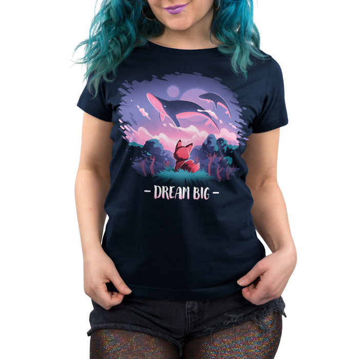Premium Cotton T-shirt_TeeTurtle navy blue Dream Big featuring an orange fox who gazes at magical whales flying in the night sky above a fantasy forest with the text "Dream Big" below.