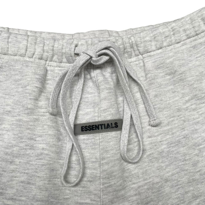 Essentials grey jogger shorts cotton material with logo detail and relaxed fit.
