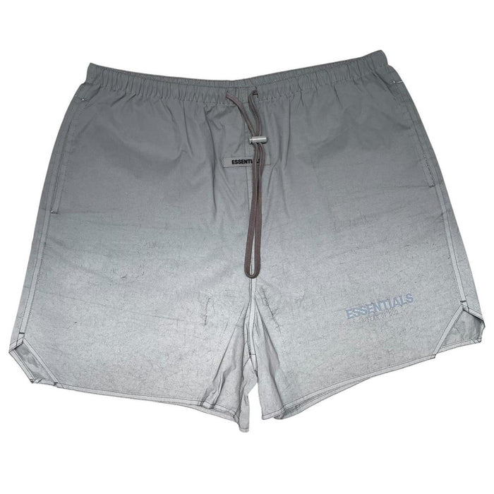 Essentials silver reflective nylon shorts with logo detail and sleek design.