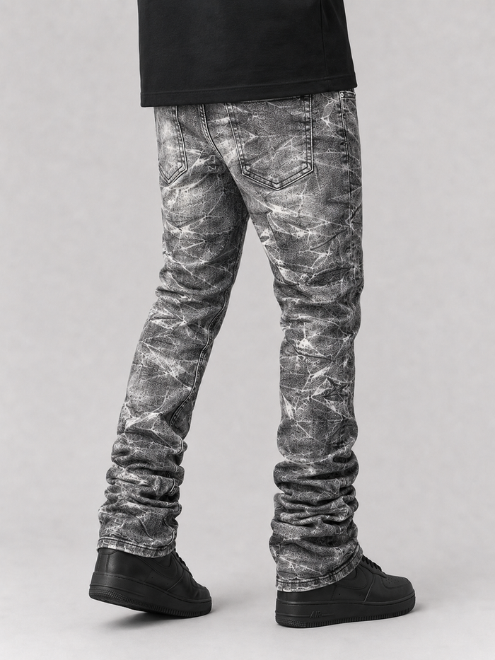 Evolution 'Explosion' stacked denim jeans in washed black, showcasing the relaxed fit and stylish design from EVOLUTION.