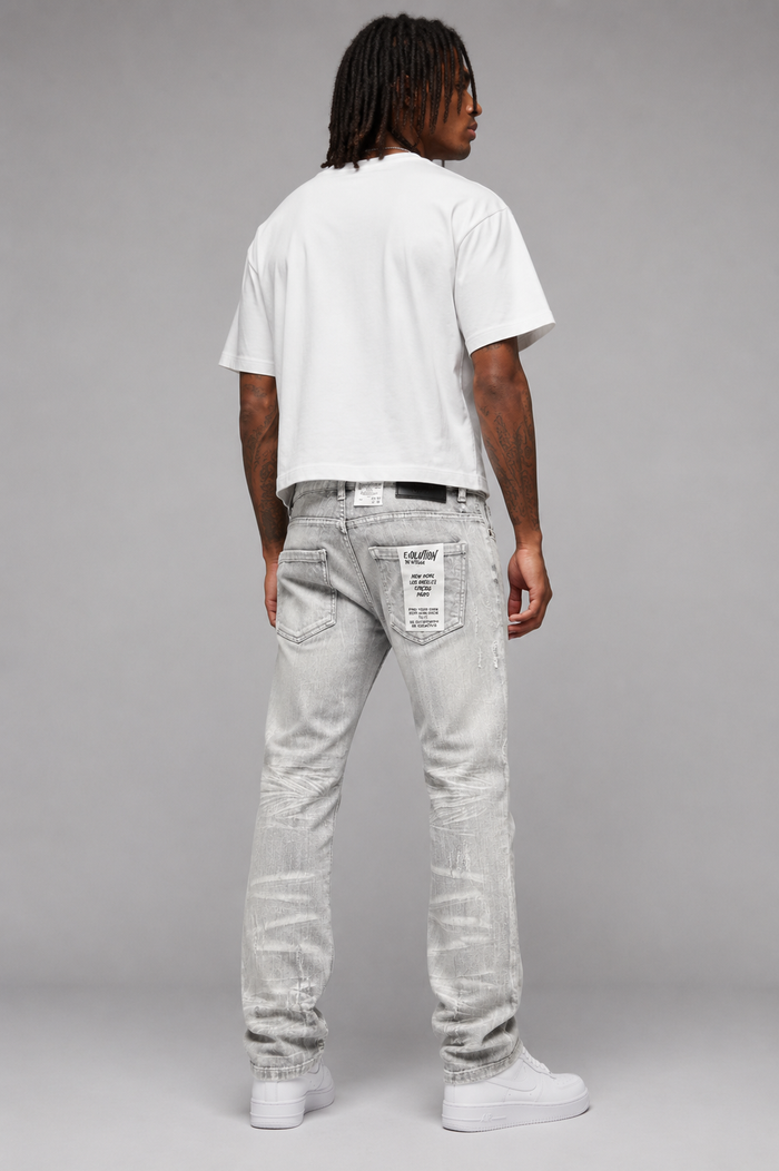 Gray Evolution 'Faded' Relaxed Straight Denim jeans displayed on a hanger, showcasing the relaxed fit and faded denim texture.