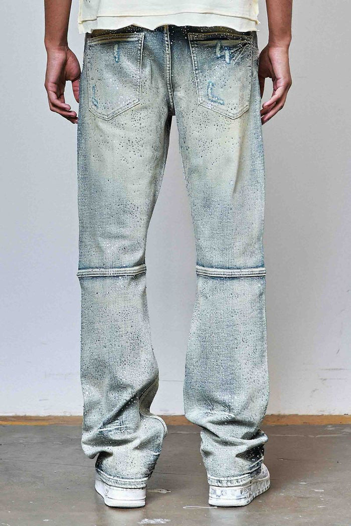 First Row allover rhinestone flare fit denim in medium stone tint, showcasing detailed rhinestone embellishments and classic denim style.