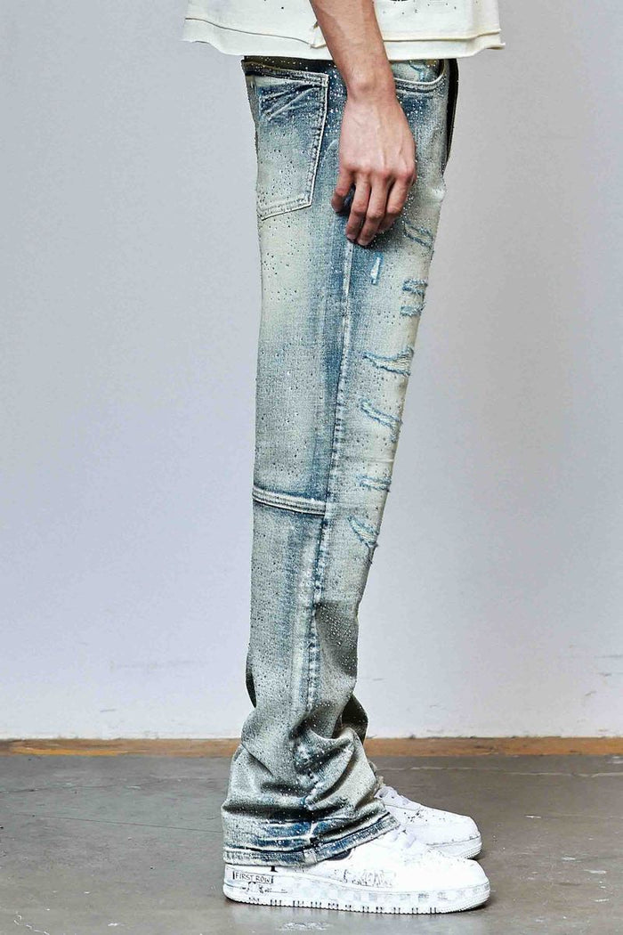 First Row Allover Rhinestone flare fit denim jeans in medium stone tint with rhinestone embellishments and classic denim styling.